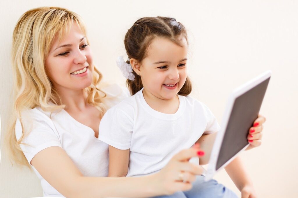 mother and daughter on a tablet