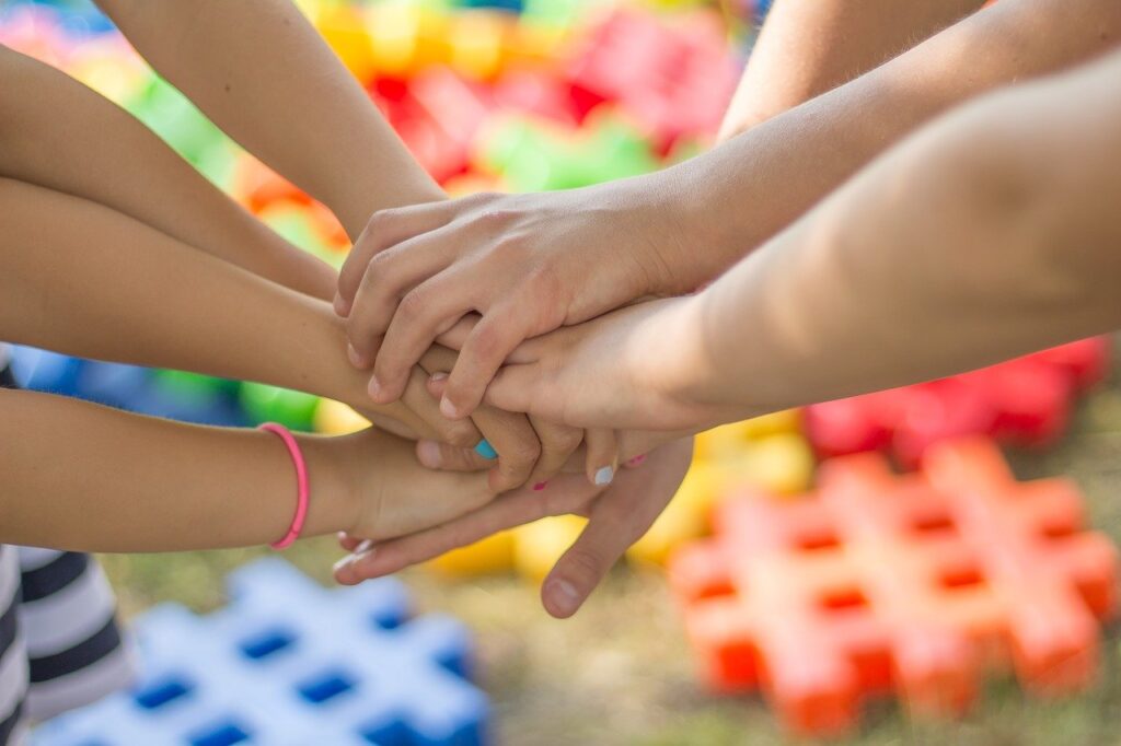 children holding hands to symbolise anti peer pressure