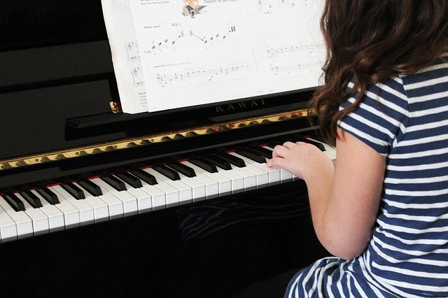 child playing piano