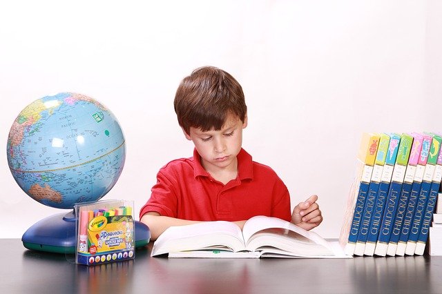 child studying at desk