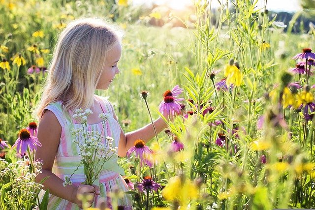girl smelling flowers
