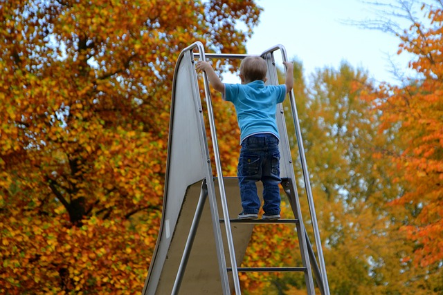child climbing a slide
