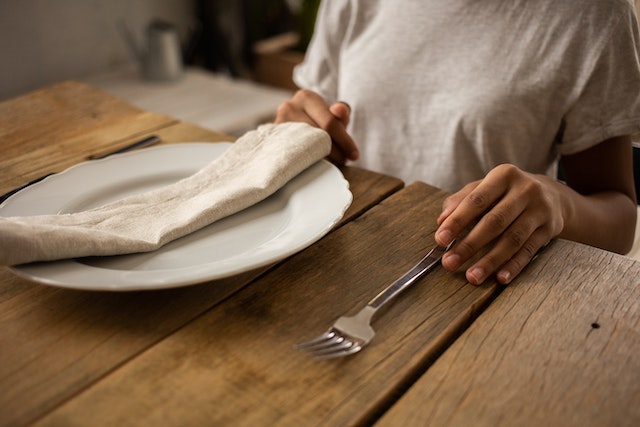 child at dining table