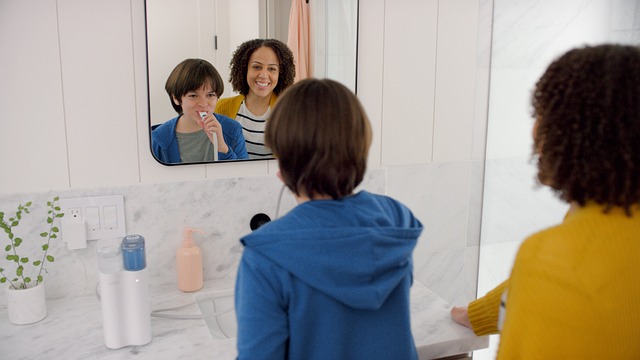 mother and son brushing teeth