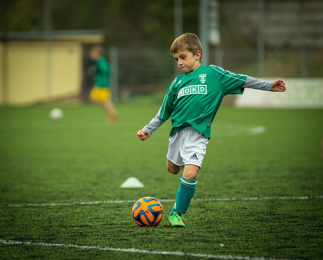 child playing football